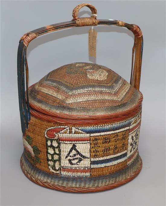 An Oriental painted wicker food carrier